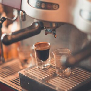 selective focus photography of espresso machine